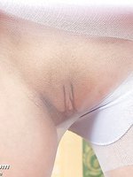 Karolina masturbates her pussy her wet vulva through her pantyhose