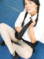 Dark haired beauty in cute college uniform with thick light pantyhose.