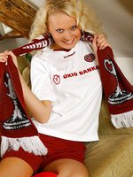 Karen stripping out of a Hearts football kit