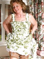 Sue in a flowery dress and tanned stockings