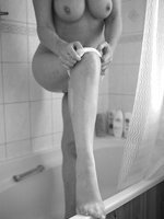 Kim Takes A Shower In Stockings