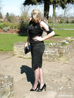 Gorgeous blonde Demi catches some sun out and about, wearing a pretty black blouse and skirt, with matching tall stilettos