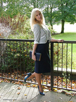 Blonde Milf Iona is teasing outdoors in a lovely pair of blue high heels