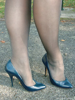 Dark blue stilettos go well with this babes blue dress and dark stockings.