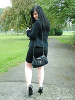 Gorgeous Nicola takes a walk outside in her black high heels.
