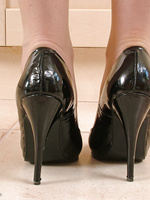 A sleek black dress and some very naughty high heels