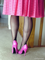 This honey looks stunning in a pink dress and high heels