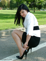 Horny stiletto girl shows off her black high heels outdoors