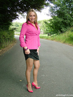 Blonde with an ankle tattoo showing of her pink high heels and sexy nylons