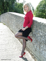 Sexy blonde with red high heels and gorgeous black nylons