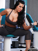 Brianna Jordan models her sweet body as she works out in the gym. She starts off by flexing her strong chest and biceps as she curls her weights.