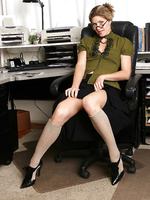 Mature office girl Delilah gets down and dirty on her desk in here