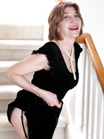 56 year old Bossy Ryder from AllOver30 opens her legs on the stairs