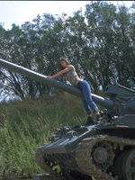 Veronica Zemanova undresses outdoors on her war machine