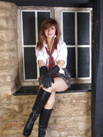 Naughty Sam is wearing her tartan mini skirt and long leather boots