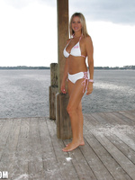 Rio posing outside her lake house with a sexy bikini on