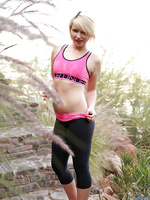 Gorgeous blonde in her workout gear strips down and masturbates outside