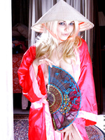 Alluring blonde teen posing her fuckable body with a nice red kimono dress