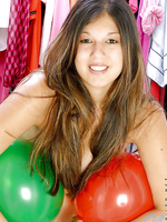 Long haired fresh teen posing just with balloons around her