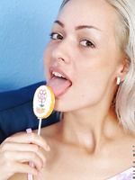 Oh man look at how she sucks her lollipop i bet she is wishing it is a nice tasty cock