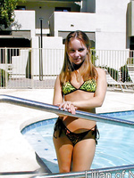 Sexy teen gets all wet in the swimming pool