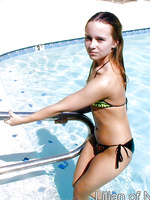 Sexy teen gets all wet in the swimming pool