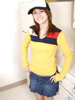 Sweet teen in a truckers cap and a tight yellow top looks hot