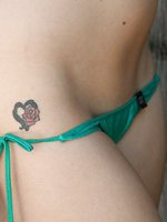 This itty bitty green bikini cannot contain all of Jessi June