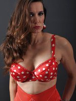 Sexy red polka dot bra holds Nylon Janes big tits in place
