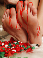 This is for my naughty foot fetish lovers who love to see me play with my sexy feet and toes. I was baking some goodies and decided to stick my toes and feet in some sweet candy.