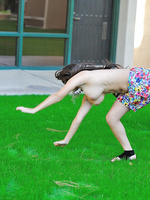 Leila does cartwheels topless outside