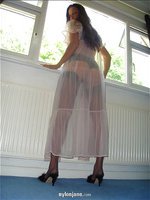 Jane dresses for bed in a see through negligee