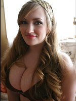 Sara Willis posing while showing her huge boobs