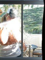 Kelly cleans her windows and gets her white shirt all wet!