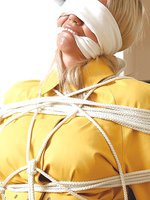 This gorgeous blonde housewife is rope tied and gagged in so many different positions