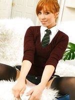 Amazing redhead Alex in a cute college uniform with grey stockings and suspenders.