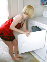 Blonde MILF gets hot doing laundry so she strips naked
