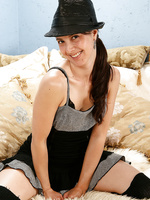 Skinny 34 year old Lily wearing kinky black lingerie and a fedora