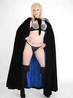 Super girl Axajay is dressed up in a cloak with a tiny thong and gorgeous black boots
