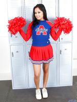 Flirtatious horny cheerleader pulls up her red skirt and bares her alluring tight teen hole