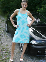 this is one hell of a cute teen just look at her and the beautiful bmw she is sitting on flashing