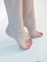 Nylon Jane shows off her very sexy feet on this foot play shoot.
