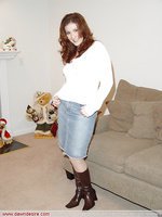 Beauty in jeans skirt and long boots
